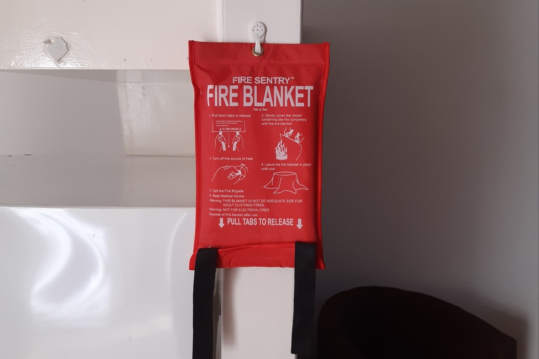 Professional fire safety equipment installation including smoke detectors and extinguishers