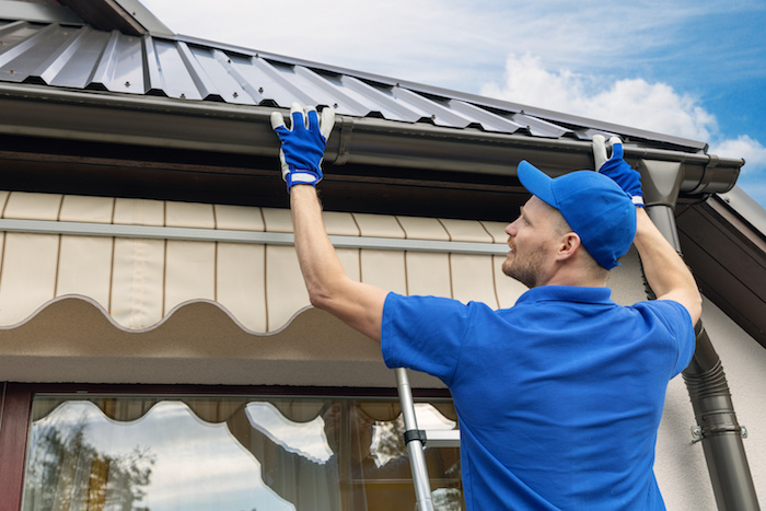 Professional roofing installation on a residential house with quality materials