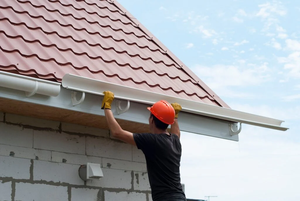 Seamless gutter installation protecting home from water damage
